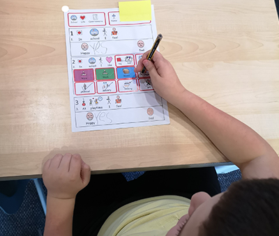 Student using Widgit Symbols