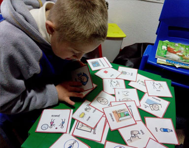 Student with symbol cards