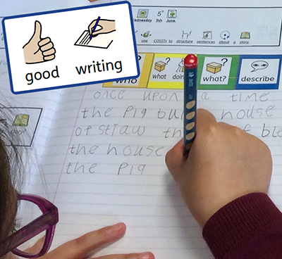 Child using symbols to support writing activity
